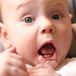 Baby doing lip tie exercises