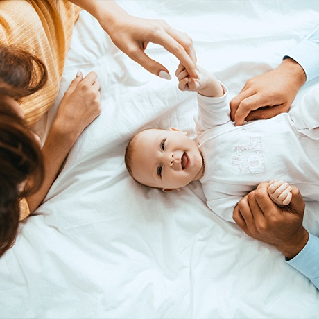 Doctor Maggie examining baby after lip and tongue tie treatment