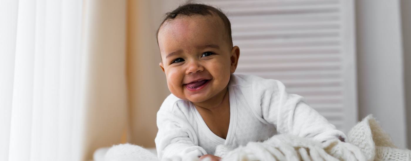 Baby laughing after infant tongue tie treatment