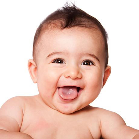 Laughing baby about frenum therapy