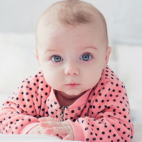 Smiling baby after frenectomy treatment