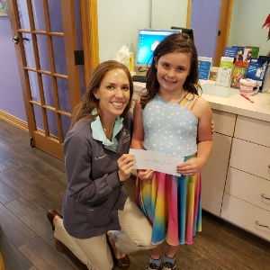 Doctor Davis smiling with young patient