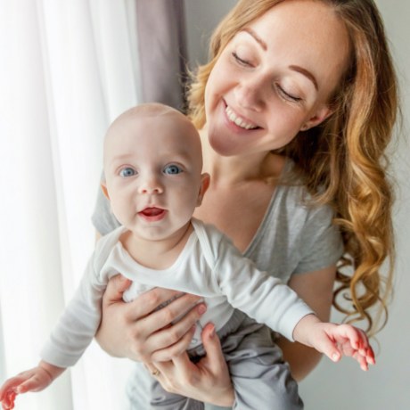 Smiling mother and baby