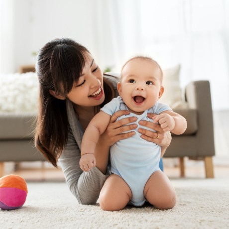 Mother and baby playing together