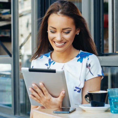 Parent looking at aftercare instructions on tablet computer