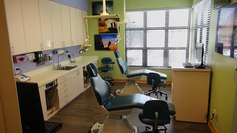 Room with two dental treatment chairs