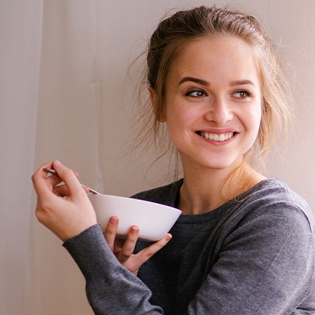 Woman with tethered oral tissue issues eating soup