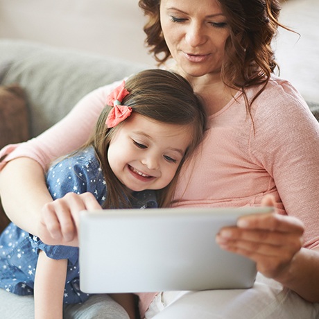 Mother and daughter practicing pronunciation after tethered oral tissues caused a speech impediment