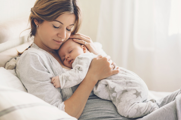 woman and baby napping