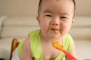 baby eating baby food