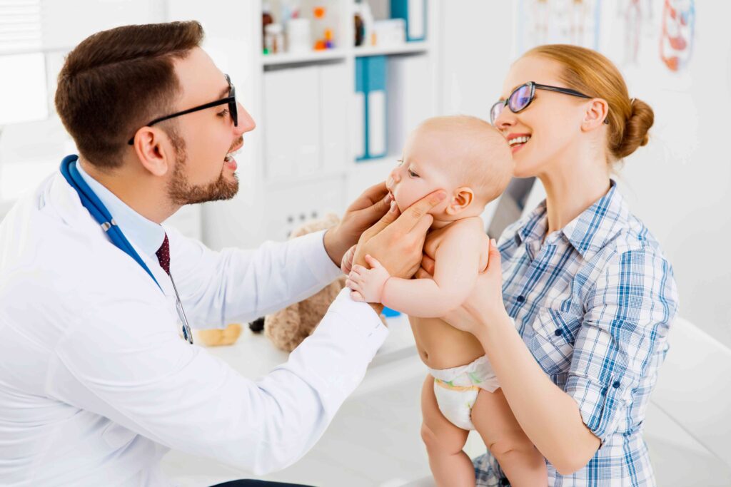 Woman holding a baby at the dentist